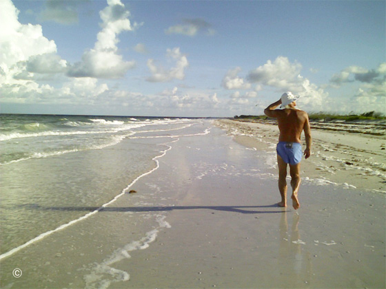 "It's like a 'walking prayer' in a 360 degree open air cathedral…" Hal walking on a pristine barrier island beach along the Gulf of Mexico.   Photo by B.J. Stowers ©2008