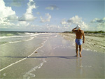 "It's like a 'walking prayer' in a 360 degree open air cathedral…" Hal walking on a pristine barrier island beach along the Gulf of Mexico.   Photo by B.J. Stowers ©2008